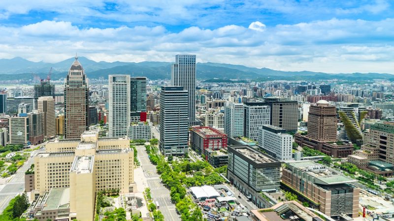 Asia Business concept for real estate and corporate construction - panoramic modern cityscape building bird eye aerial view under sunrise and morning blue bright sky, shot in Taipei 101, Taiwan