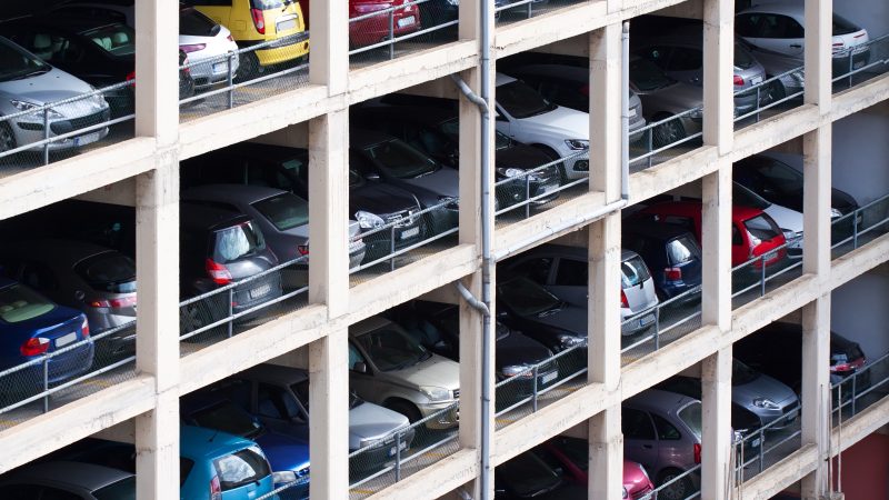 multilevel parking place with many cars in European city