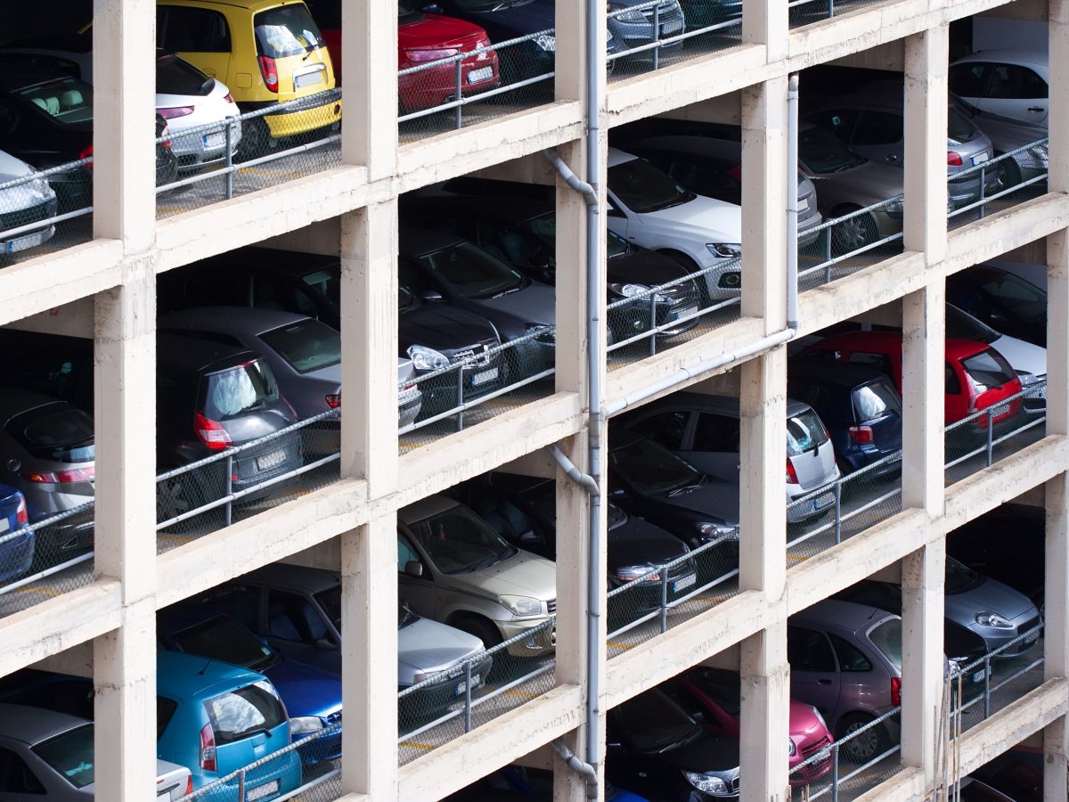 multilevel parking place with many cars in European city