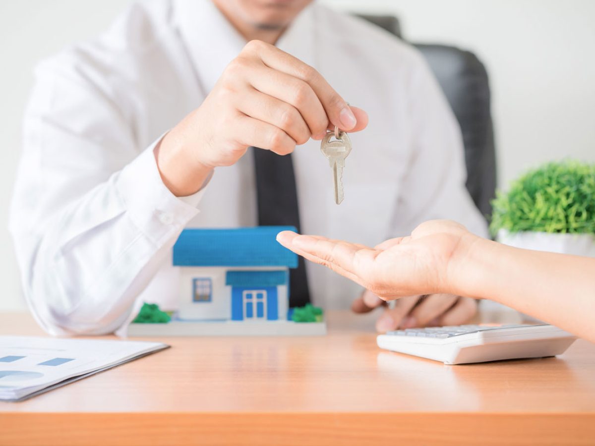 realtor-agent-giving-key-apartment-new-owner