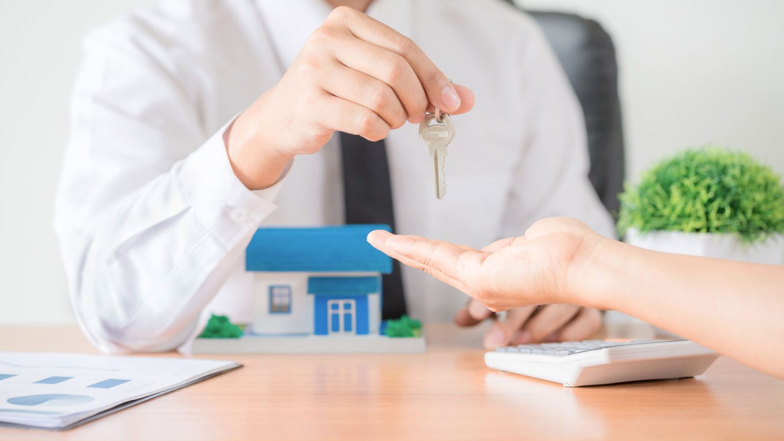 realtor-agent-giving-key-apartment-new-owner